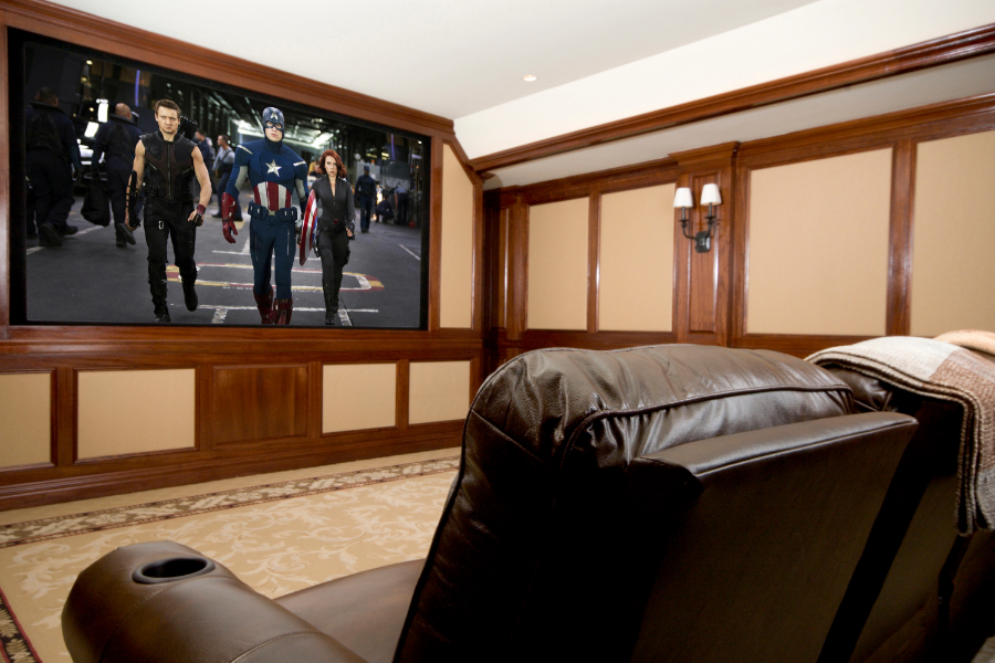 A home theater featuring leather seating, providing comfort and style to any space.