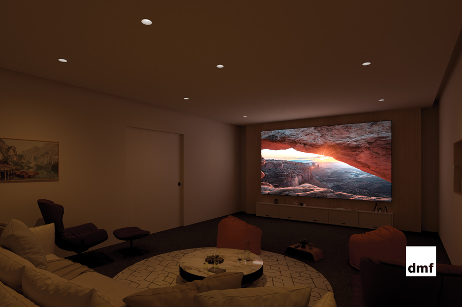 A luxury media room with a projector screen lowered and DMF recessed lighting.