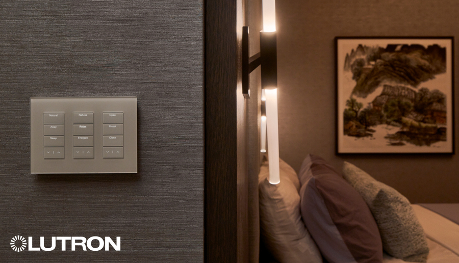 A bedroom wall with Lutron’s Palladiom keypad.