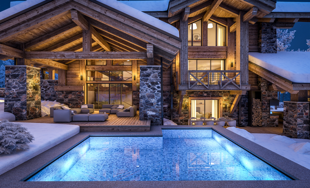 A modern, snow-covered ski lodge at night featuring a lit outdoor pool, wooden architecture, and warm interior lighting.