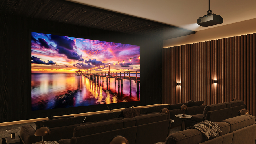 A luxury home theater with golden, pleated wall panels and a sunset beach scene on the projector screen.